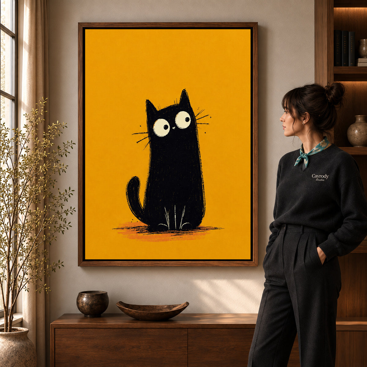 minimalist mustard cat canvas art shown in the walnut frame option within a warm living room.