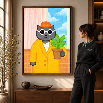 whimsical plant lover cat canvas art in a walnut frame beside a standing woman and wooden console.
