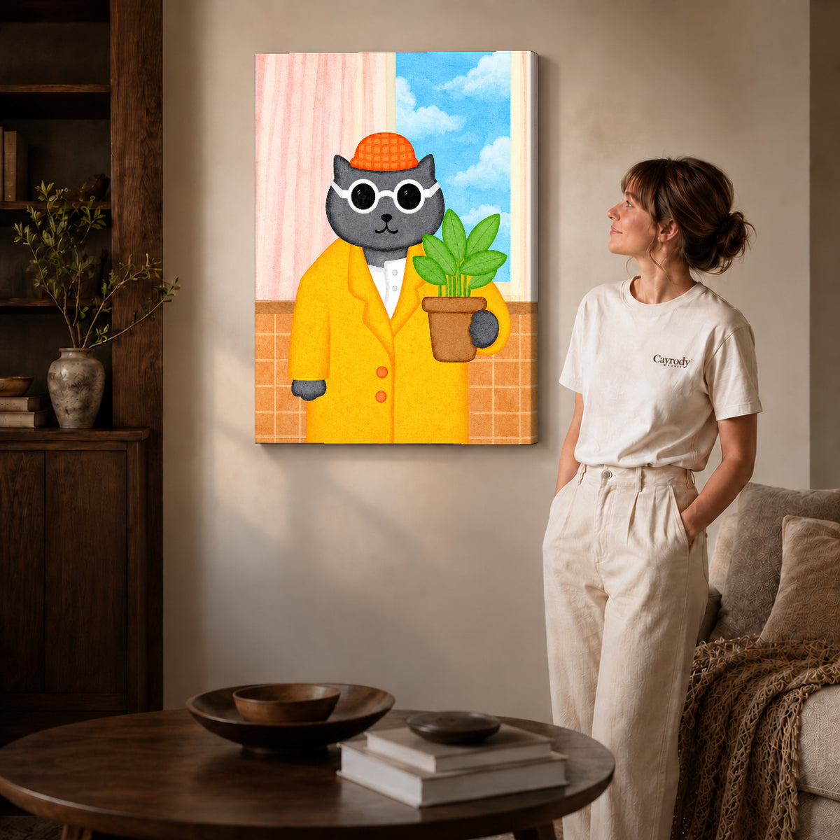 whimsical plant lover cat canvas art on gallery-wrapped canvas with natural edge shading beside a standing woman.