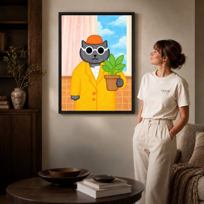 whimsical plant lover cat canvas art shown in the black frame option against a softly lit wall.