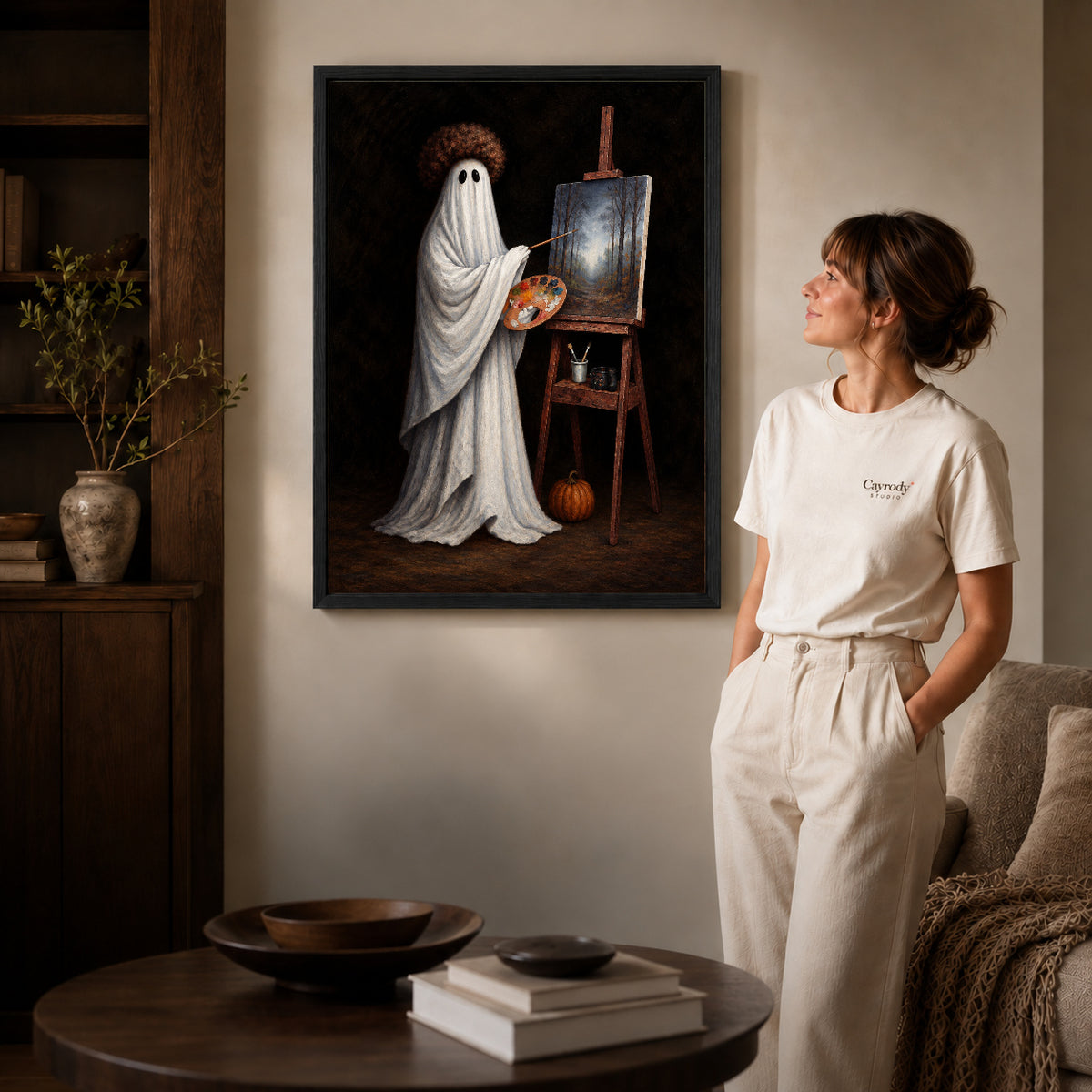 vintage ghost painter canvas art shown in the black frame option against a softly lit wall.