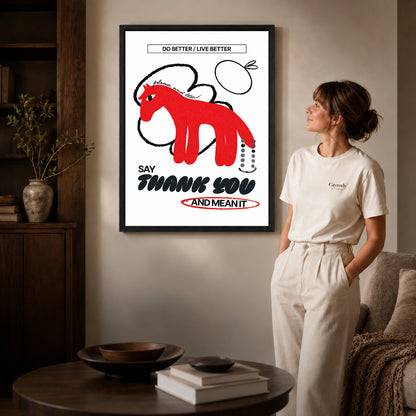 graphic gratitude horse canvas art shown in the black frame option against a softly lit wall.