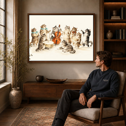 vintage cat orchestra canvas art in a walnut frame above a console beside a seated man.
