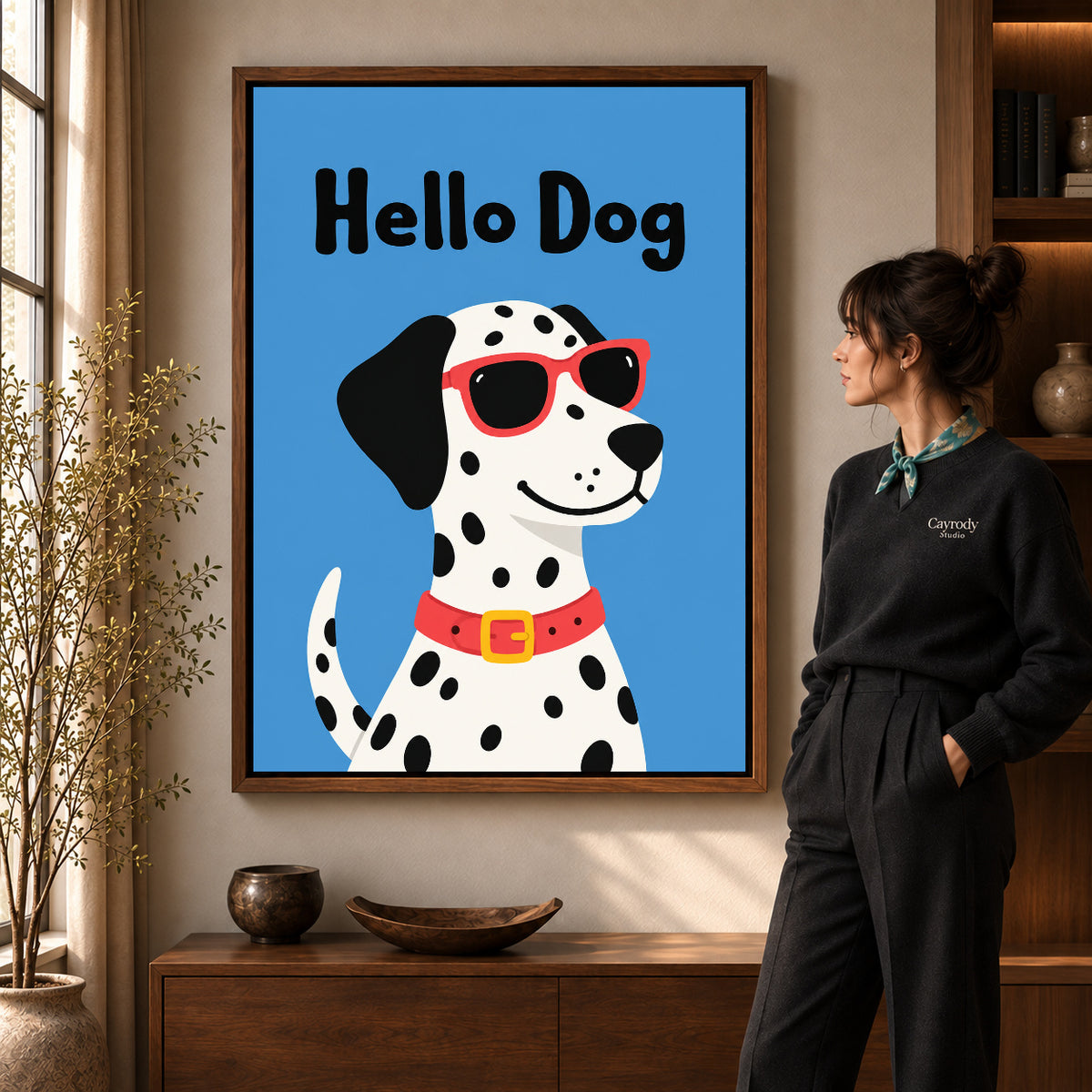 playful hello dog canvas art in a walnut frame beside a standing woman and wooden console.