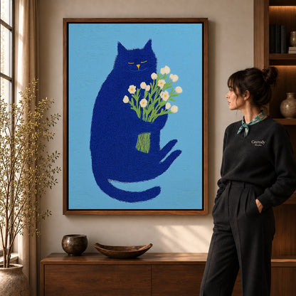 blue cat with flowers canvas art shown in the walnut frame option within a warm living room.