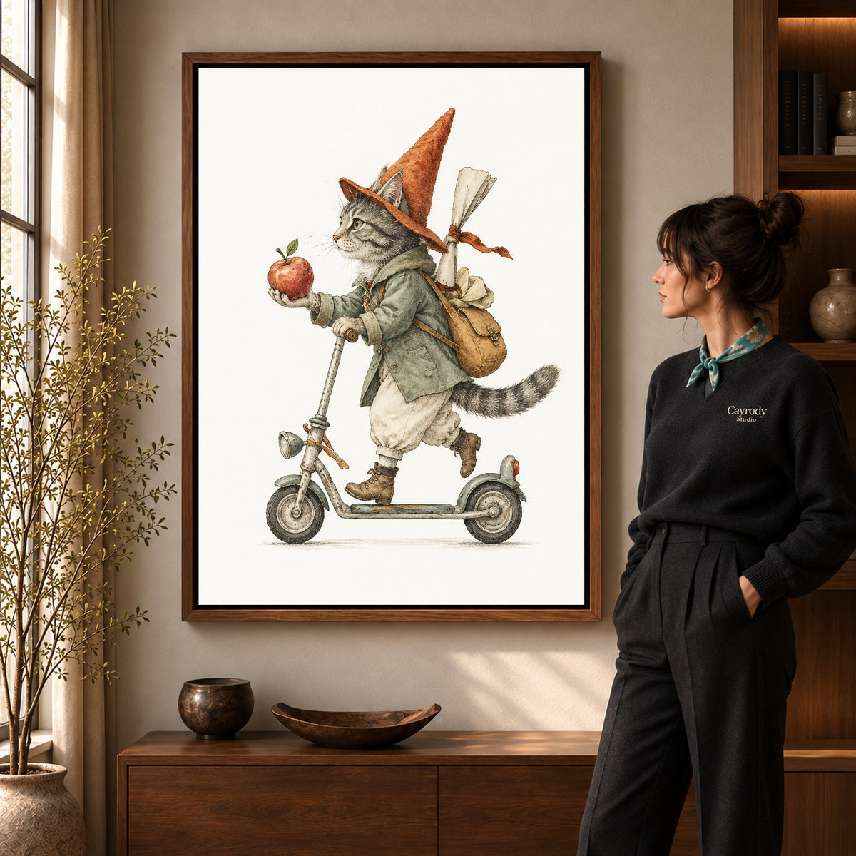 vintage scooter cat canvas art in a walnut frame beside a standing woman and wooden console.