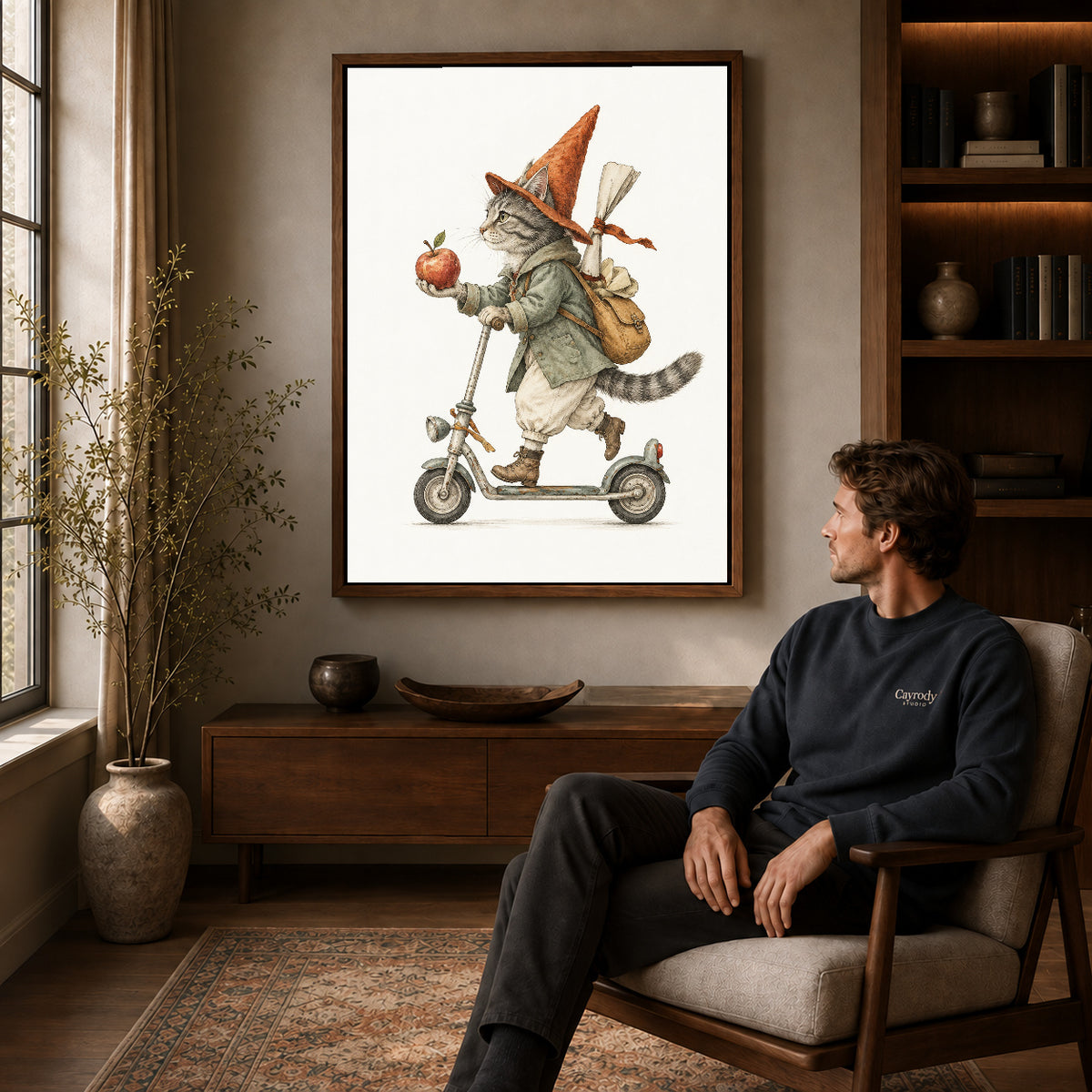 vintage scooter cat canvas art in a walnut frame above a console beside a seated man.