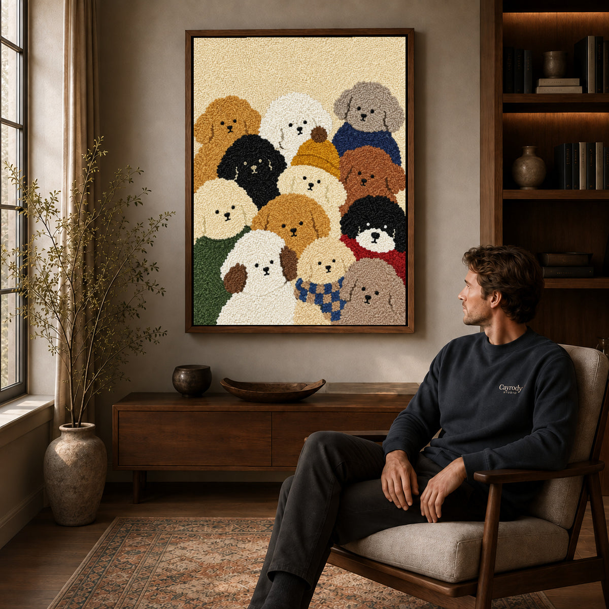 cozy curly dog friends canvas art in a walnut frame above a console beside a seated man.