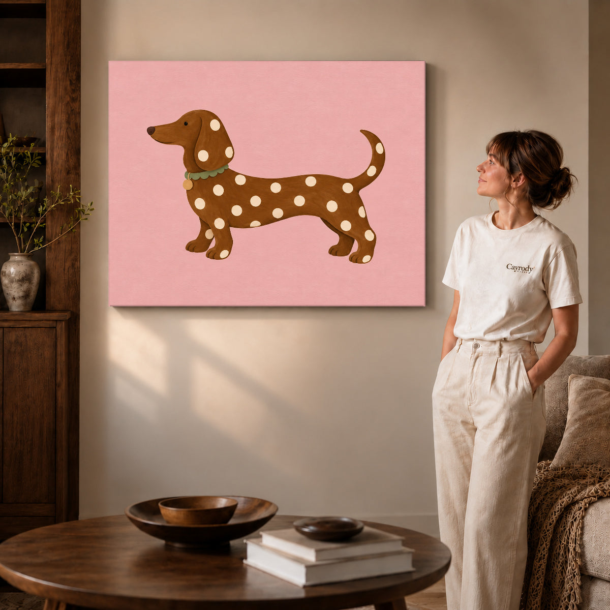polka dot dachshund canvas art on gallery-wrapped canvas with visible edge depth beside a standing woman.