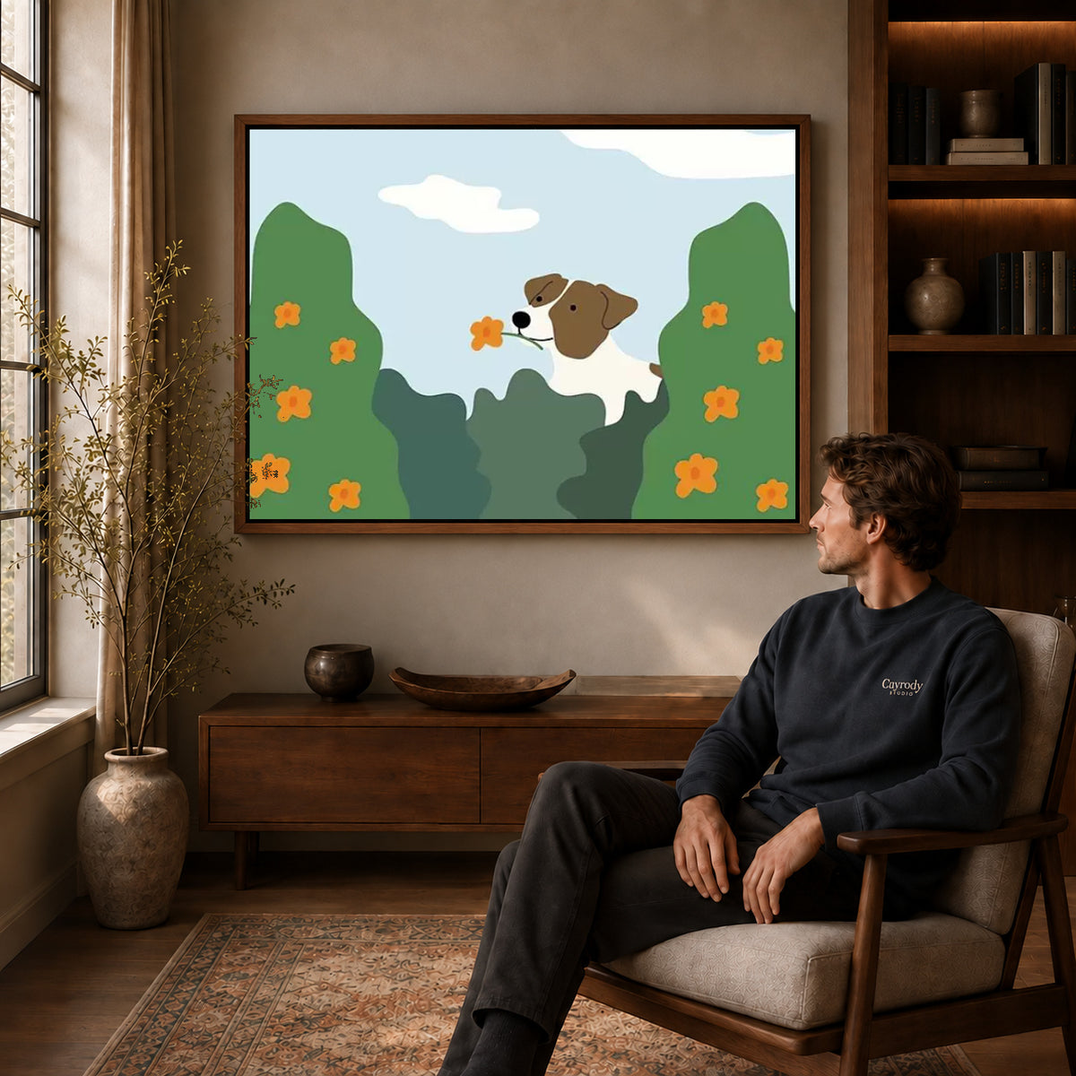 gentle garden dog canvas art in a walnut frame above a console beside a seated man.