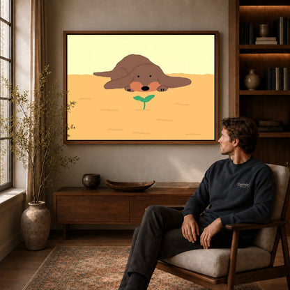 gentle puppy sprout canvas art in a walnut frame above a console beside a seated man.