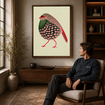 decorative spotted finch canvas art in a walnut frame above a console beside a seated man.