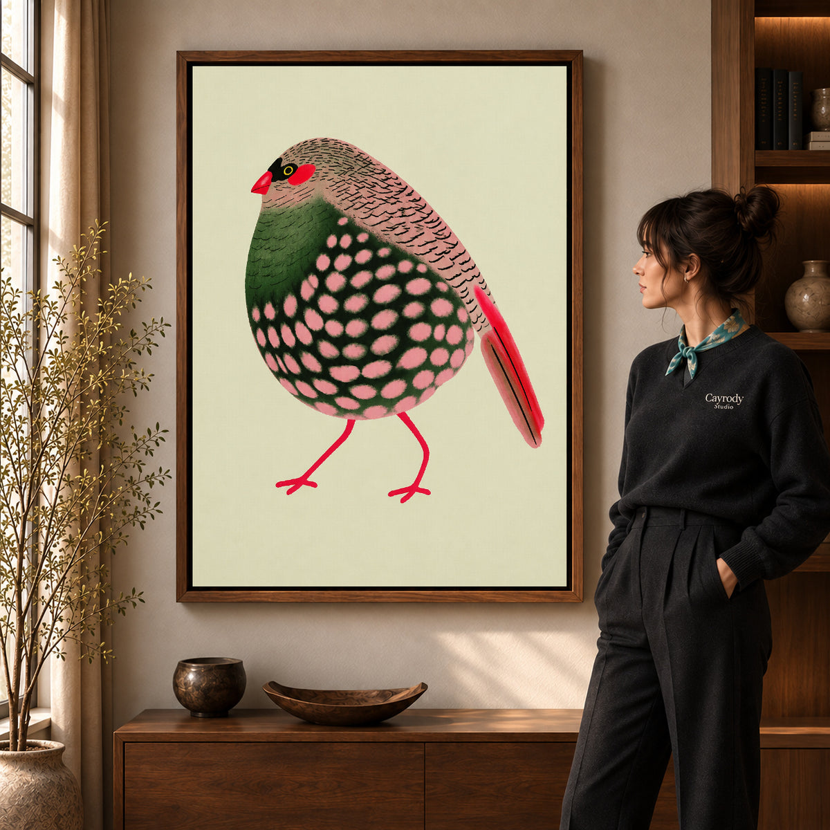 decorative spotted finch canvas art shown in the walnut frame option within a warm living room.
