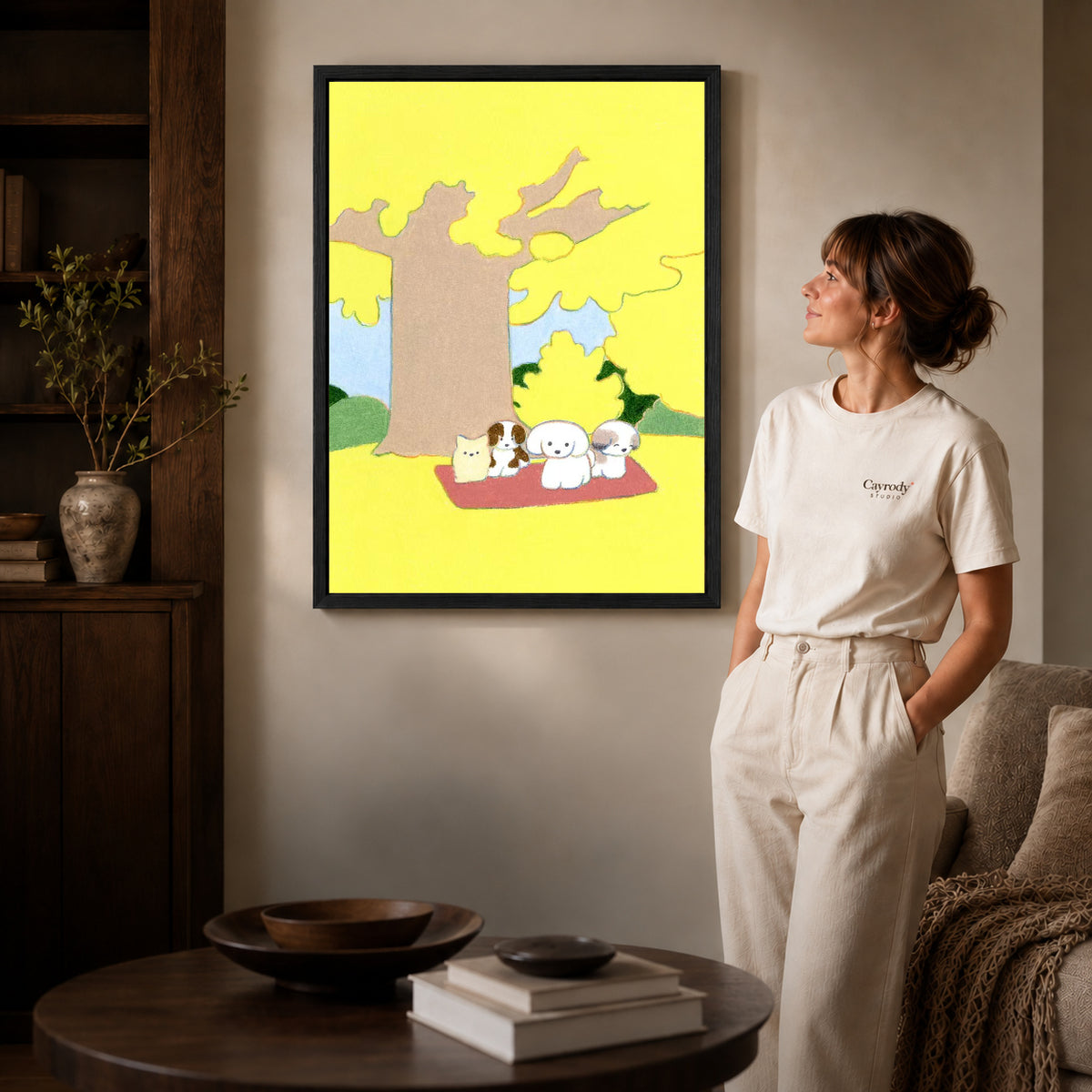 gentle autumn pet picnic canvas art shown in the black frame option against a softly lit wall.