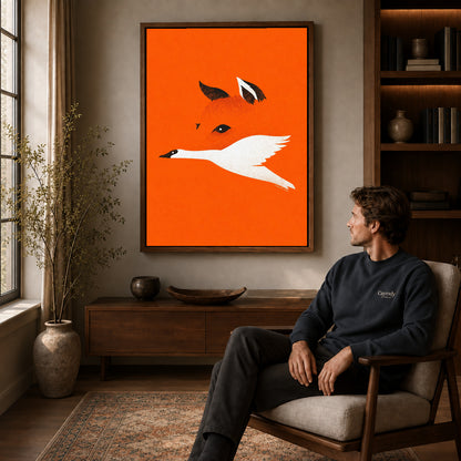 minimalist fox bird canvas art in a walnut frame above a console beside a seated man.