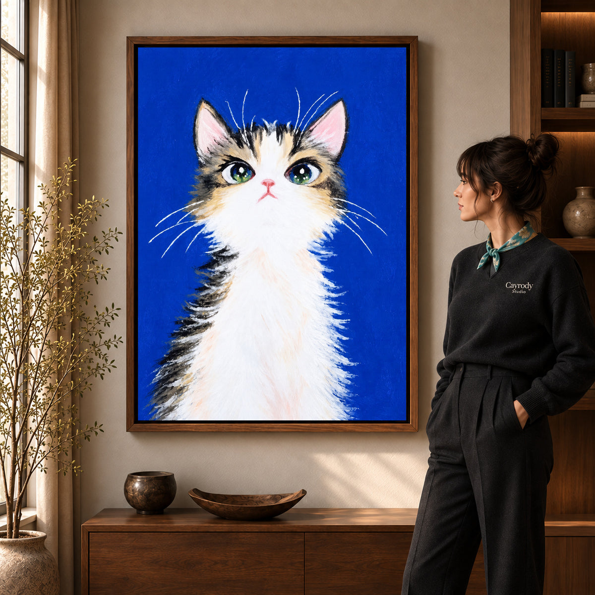 gentle blue kitten canvas art shown in the walnut frame option within a warm living room.