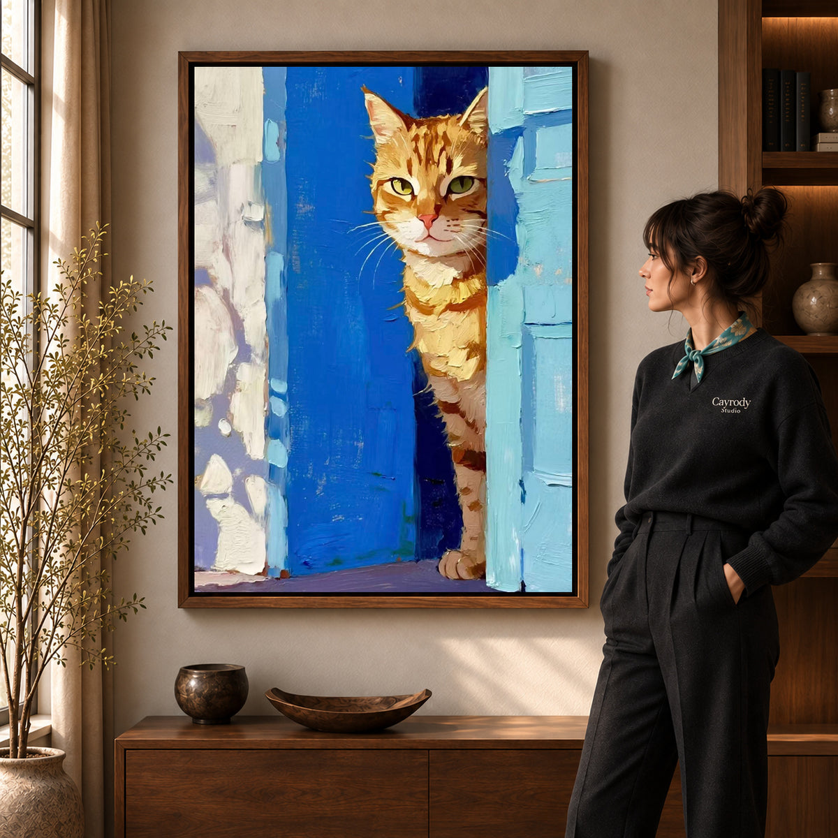 painterly doorway cat canvas art shown in the walnut frame option within a warm living room.