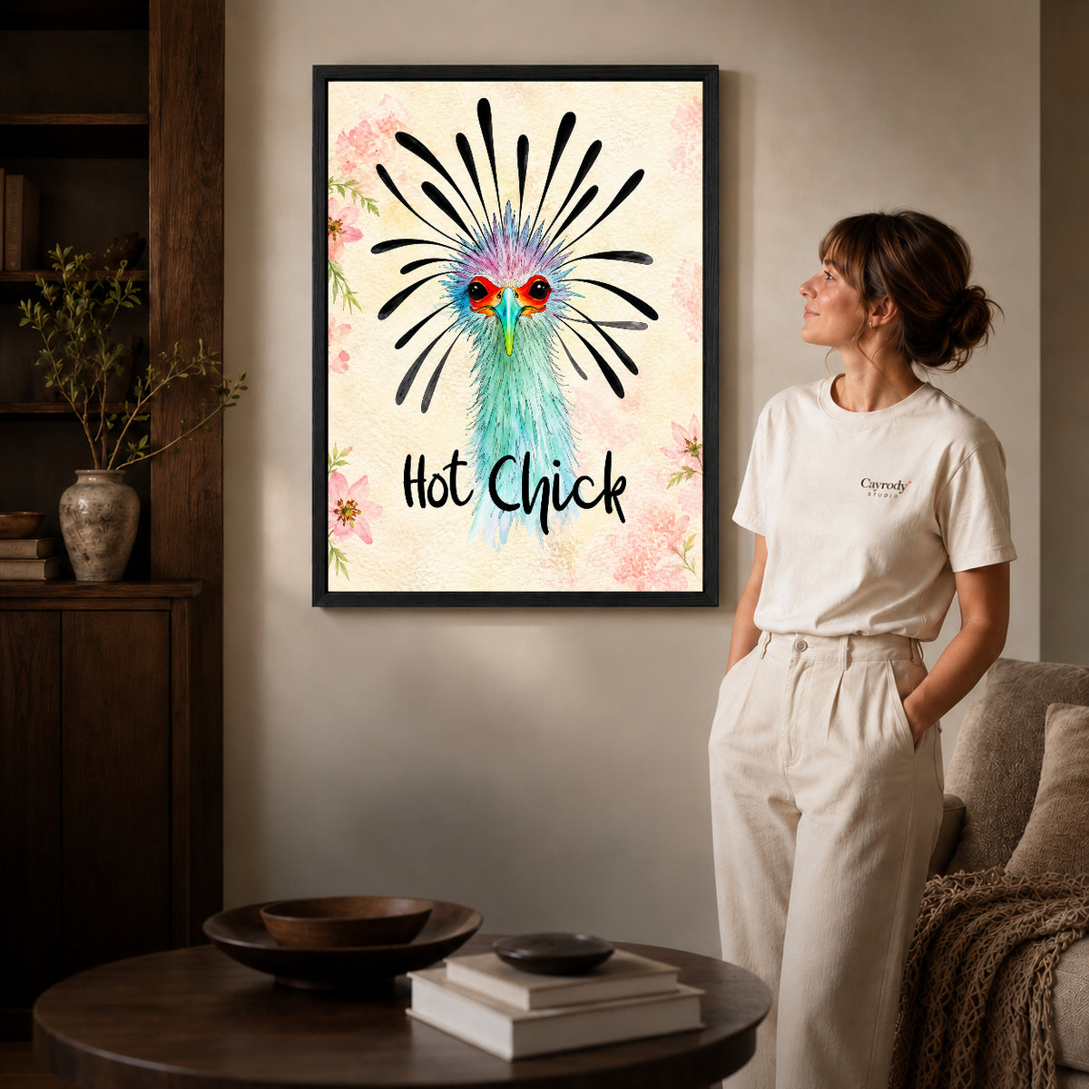 playful hot chick canvas art shown in the black frame option against a softly lit wall.