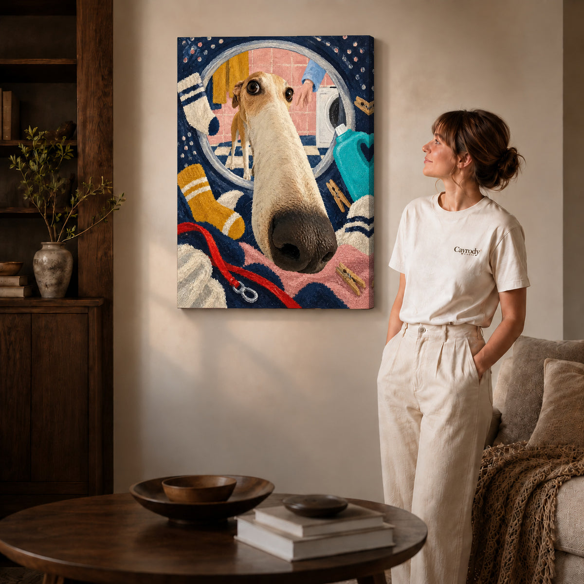playful laundry dog canvas art on gallery-wrapped canvas with natural edge shading beside a standing woman.