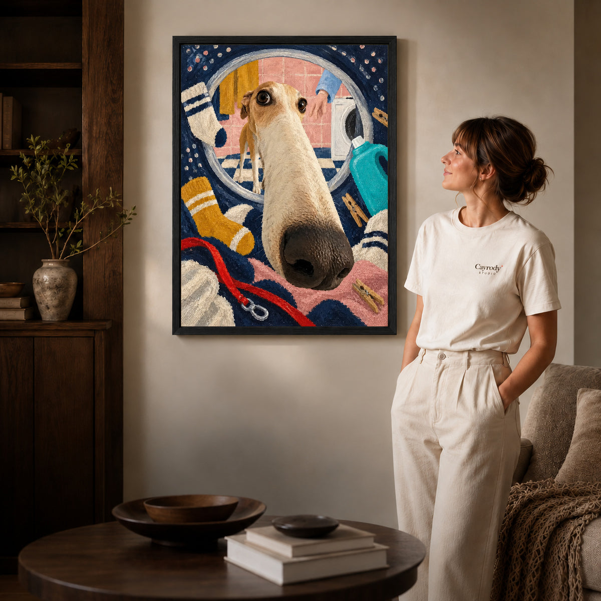 playful laundry dog canvas art shown in the black frame option against a softly lit wall.