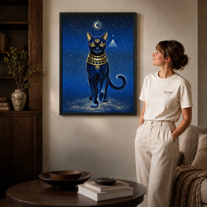 celestial golden cat canvas art in a black frame beside a woman and round wooden table.