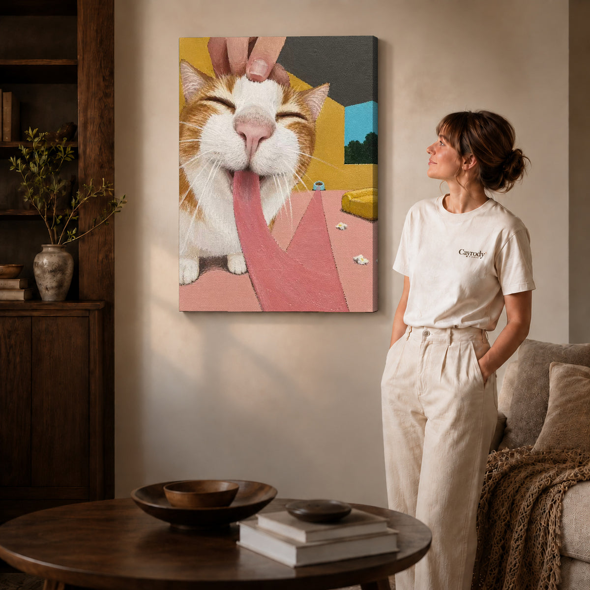 blissful long tongue cat canvas art on gallery-wrapped canvas with natural edge shading beside a standing woman.