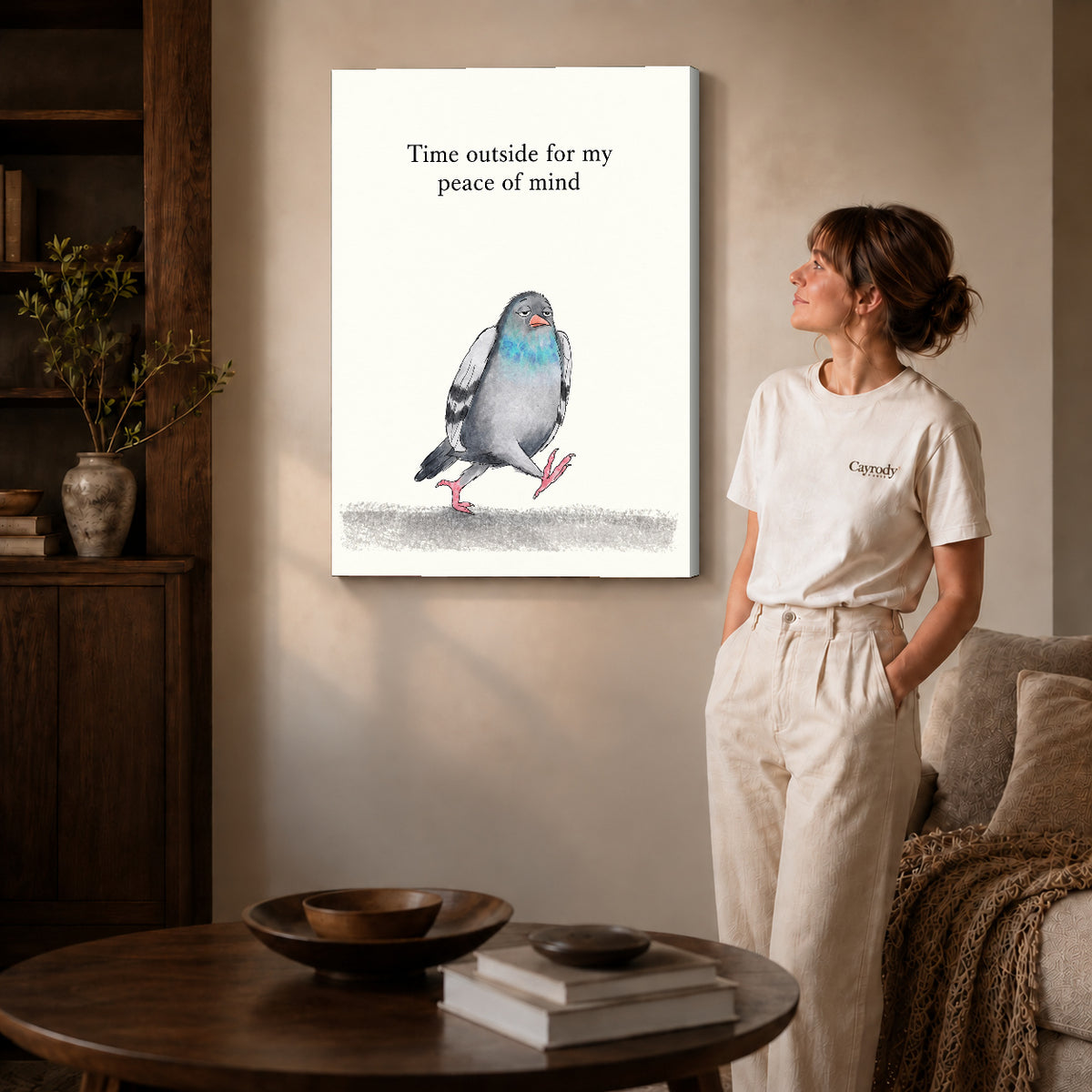 peaceful walking pigeon canvas art on gallery-wrapped canvas with natural edge shading beside a standing woman.