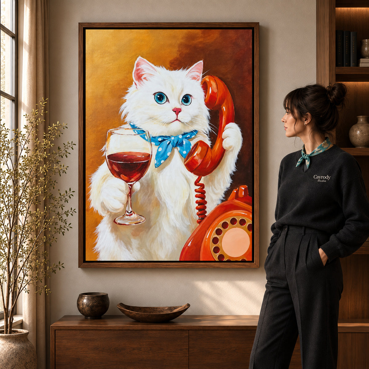 vintage telephone wine cat canvas art in a walnut frame beside a standing woman and wooden console.