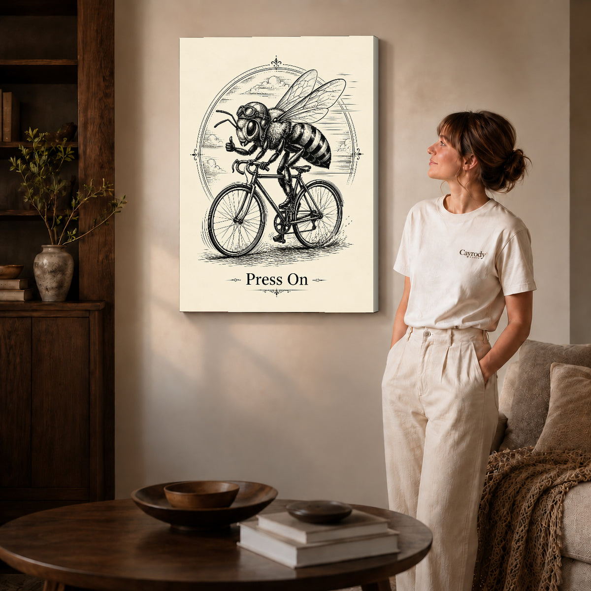 vintage cycling bee canvas art on gallery-wrapped canvas with natural edge shading beside a standing woman.