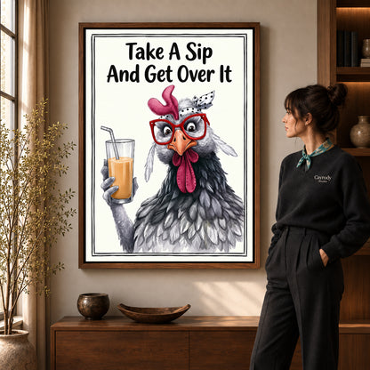 cheeky drink chicken canvas art in a walnut frame beside a standing woman and wooden console.