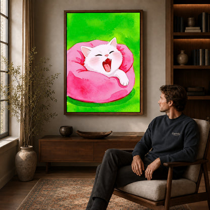 cozy yawning kitten canvas art in a walnut frame above a console beside a seated man.
