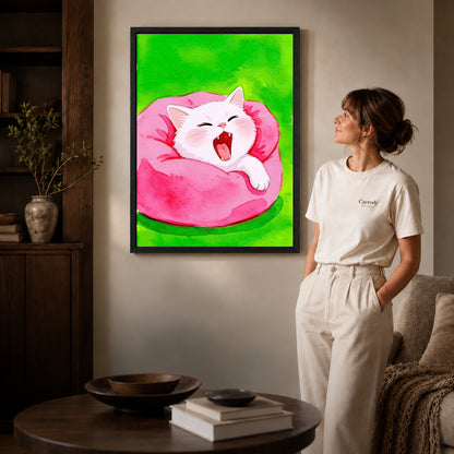 cozy yawning kitten canvas art shown in the black frame option against a softly lit wall.