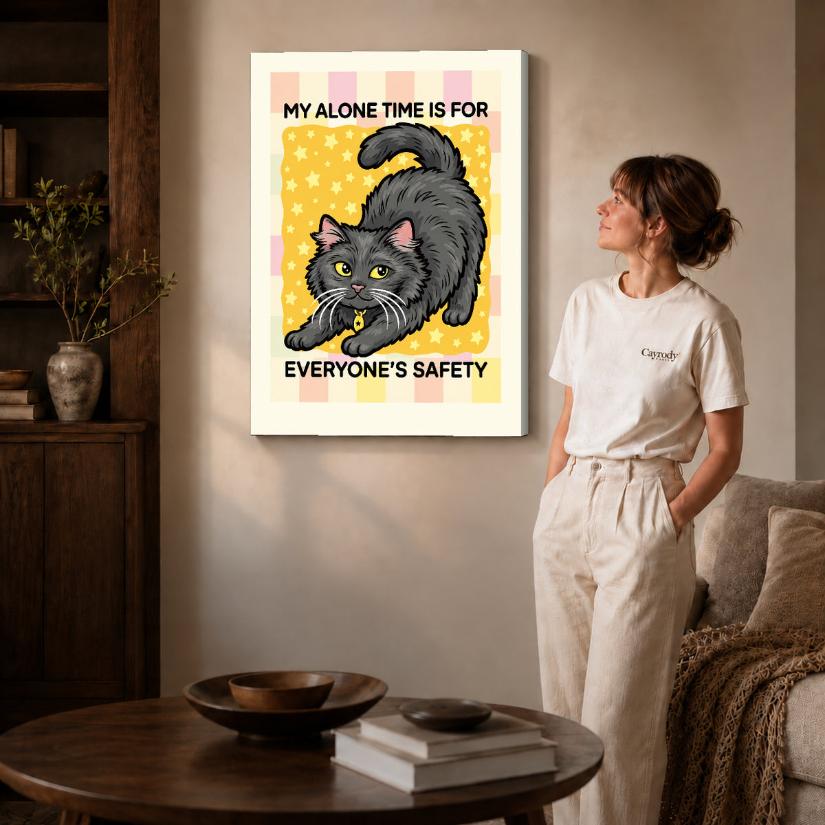 playful alone time cat canvas art on gallery-wrapped canvas with natural edge shading beside a standing woman.