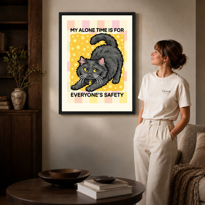 playful alone time cat canvas art shown in the black frame option against a softly lit wall.