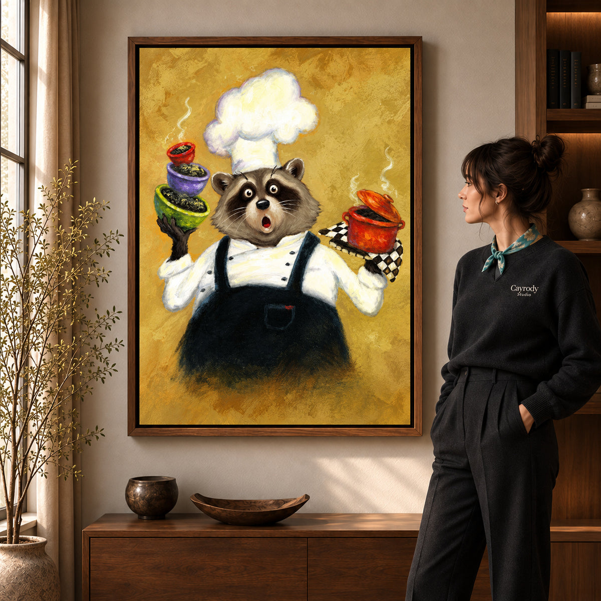 playful raccoon chef canvas art shown in the walnut frame option within a warm living room.
