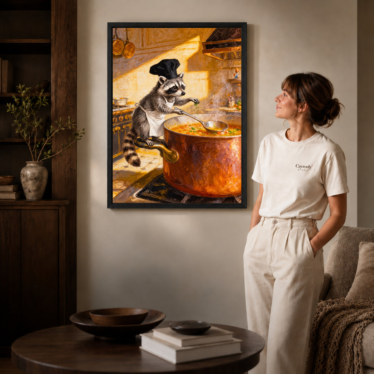warm raccoon soup chef canvas art shown in the black frame option against a softly lit wall.