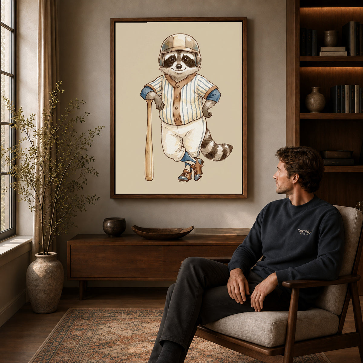 vintage baseball raccoon canvas art in a walnut frame above a console beside a seated man.