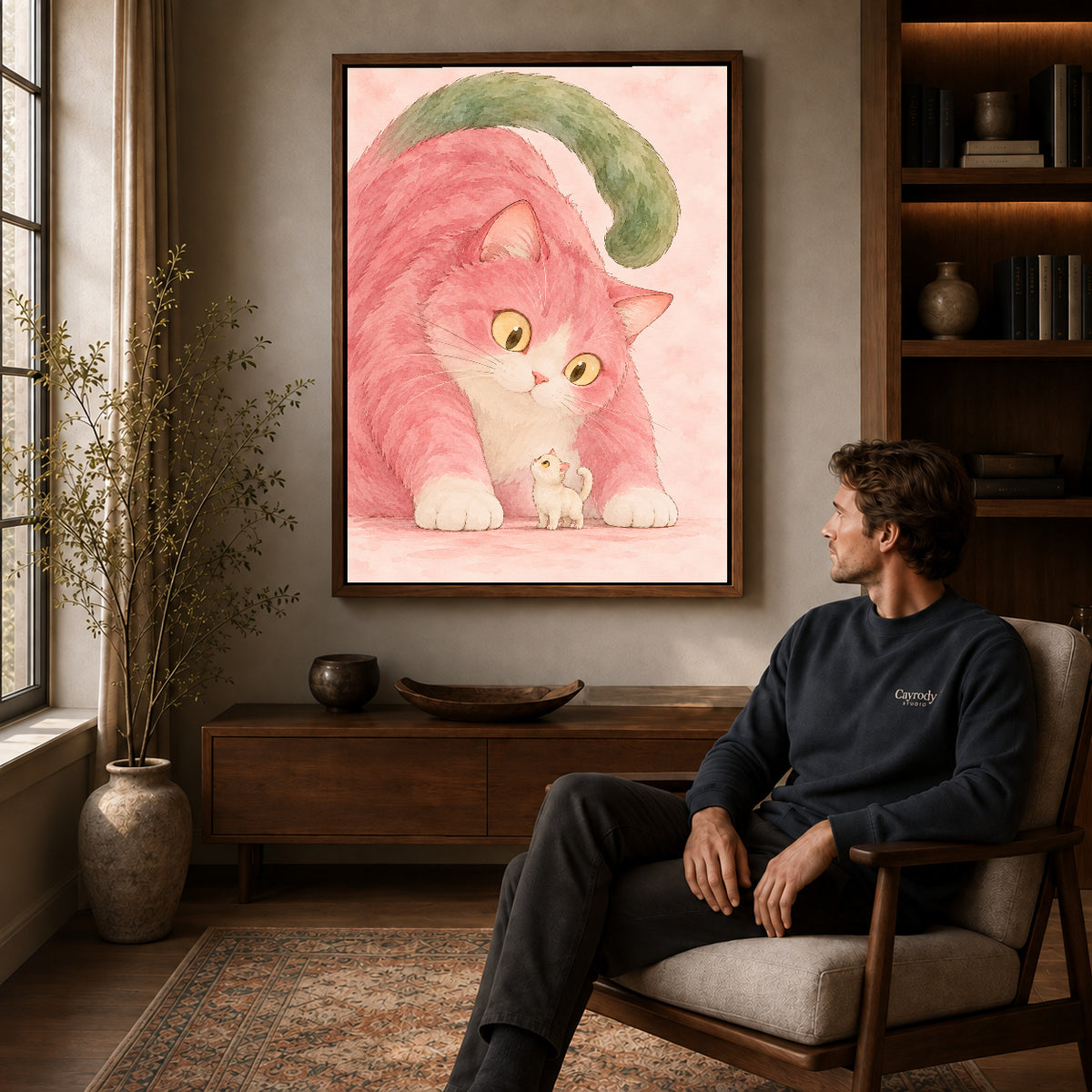 tender pink cat companions canvas art in a walnut frame above a console beside a seated man.