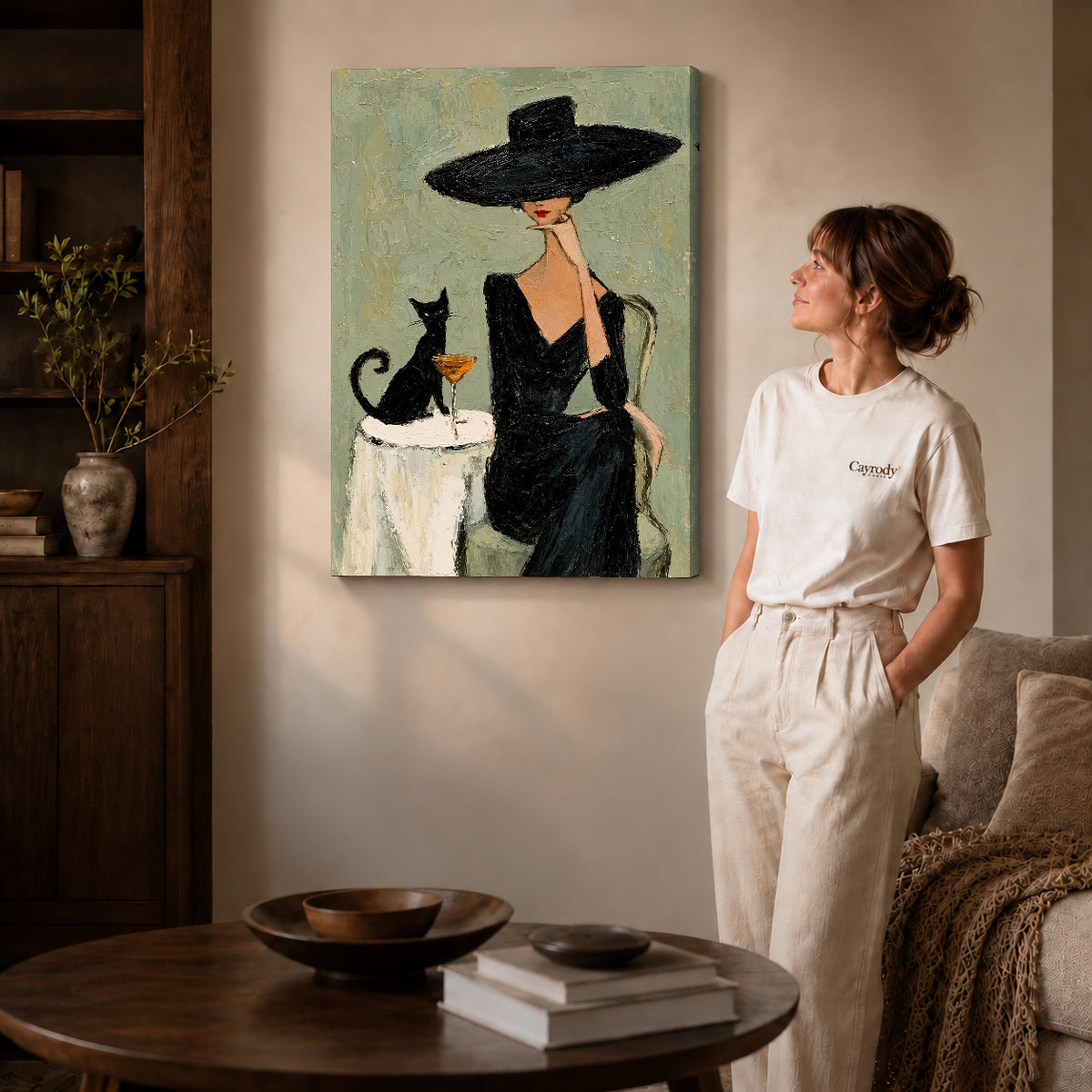 elegant woman cat portrait canvas art on gallery-wrapped canvas with natural edge shading beside a standing woman.