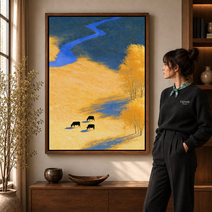 golden meadow cows canvas art shown in the walnut frame option within a warm living room.