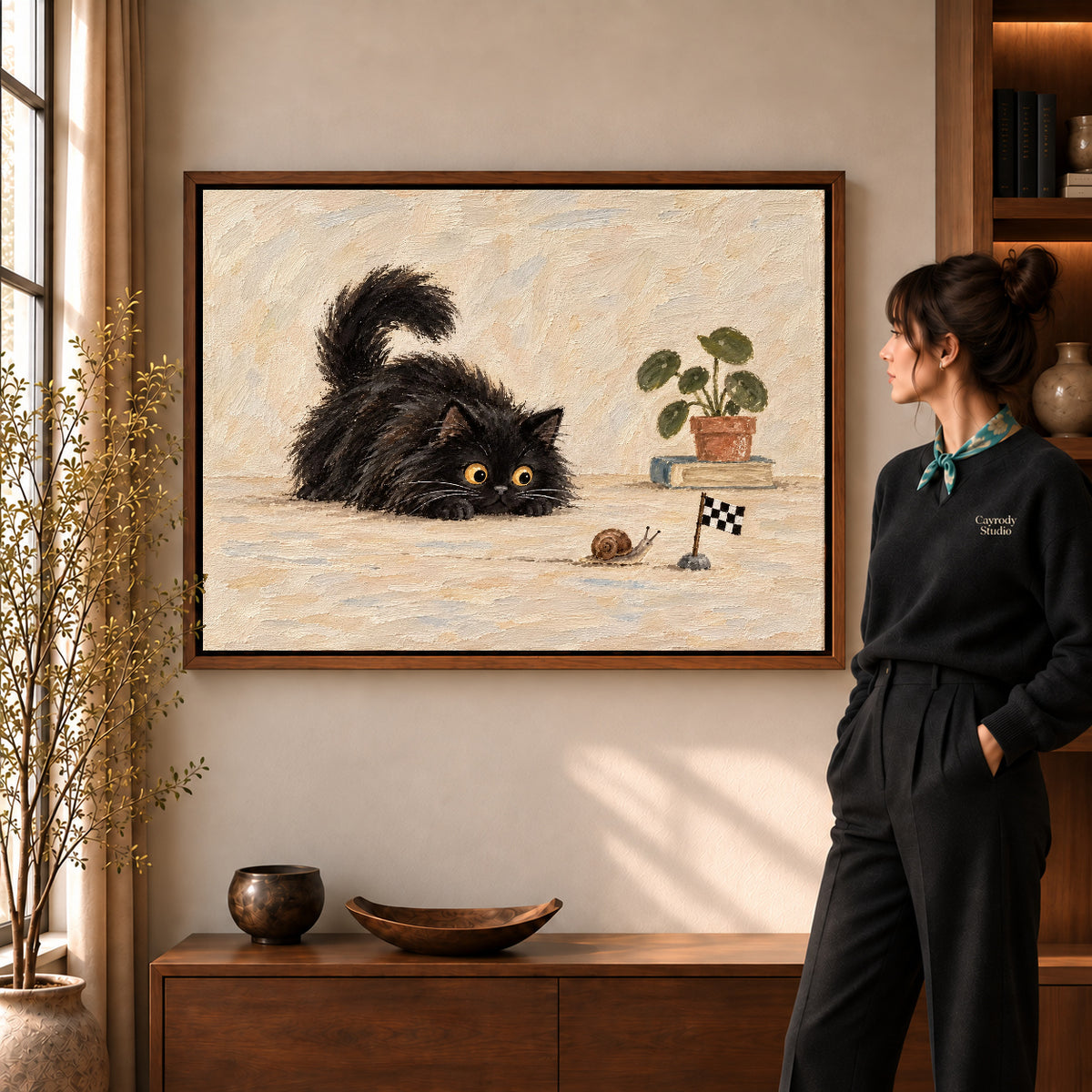 curious cat snail race canvas art in a walnut frame beside a standing woman and wooden console.