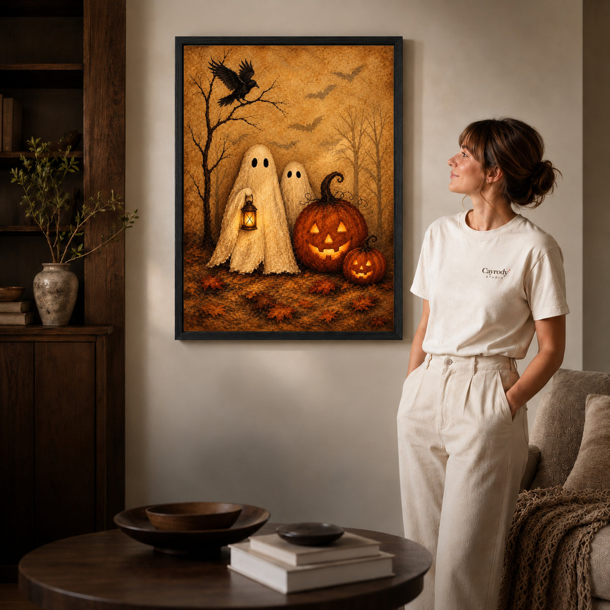 autumn ghost companions canvas art shown in the black frame option against a softly lit wall.
