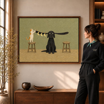 moon hanging pet friends canvas art in a walnut frame beside a standing woman and wooden console.