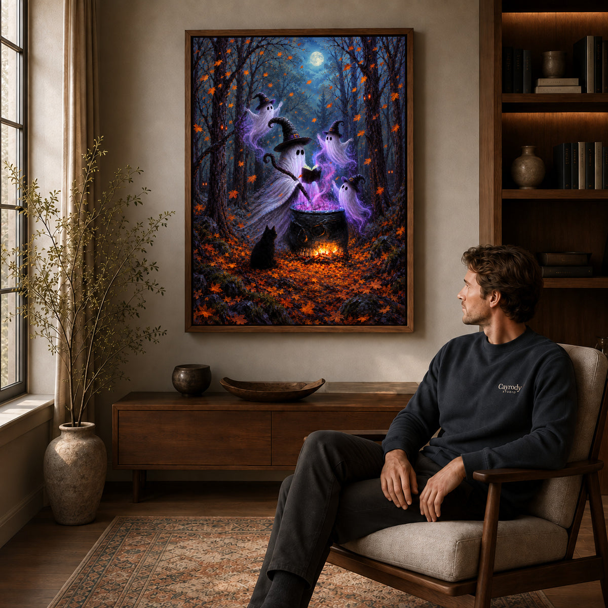 woodland ghost gathering canvas art in a walnut frame above a console beside a seated man.