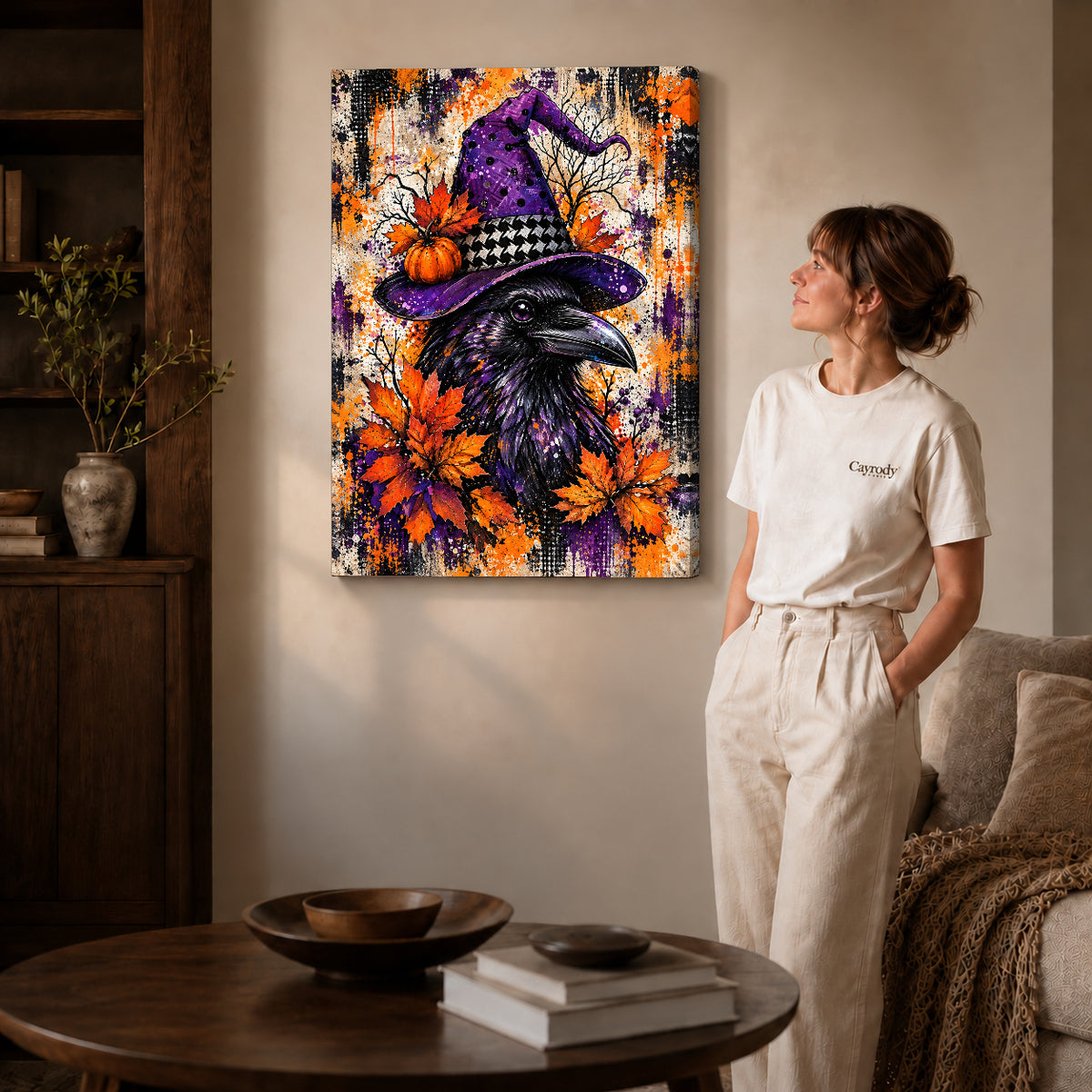 purple hat raven canvas art on gallery-wrapped canvas with natural edge shading beside a standing woman.