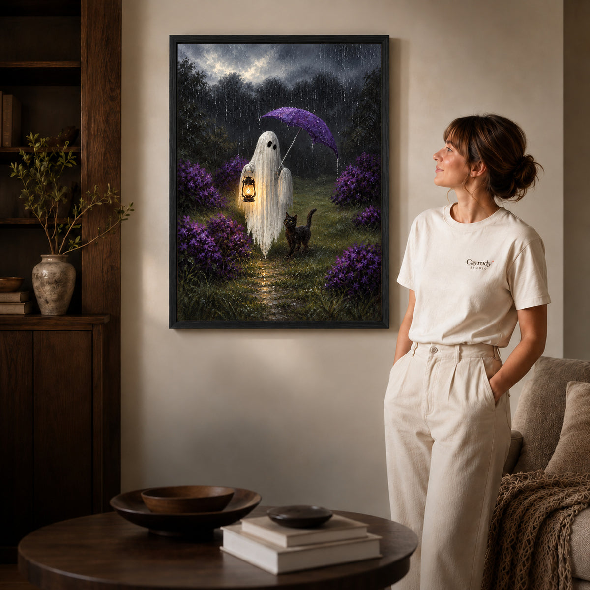 rainy ghost cat companions canvas art shown in the black frame option against a softly lit wall.