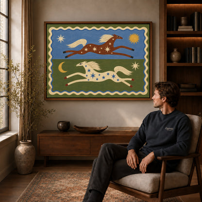 celestial folk horses canvas art in a walnut frame above a console beside a seated man.