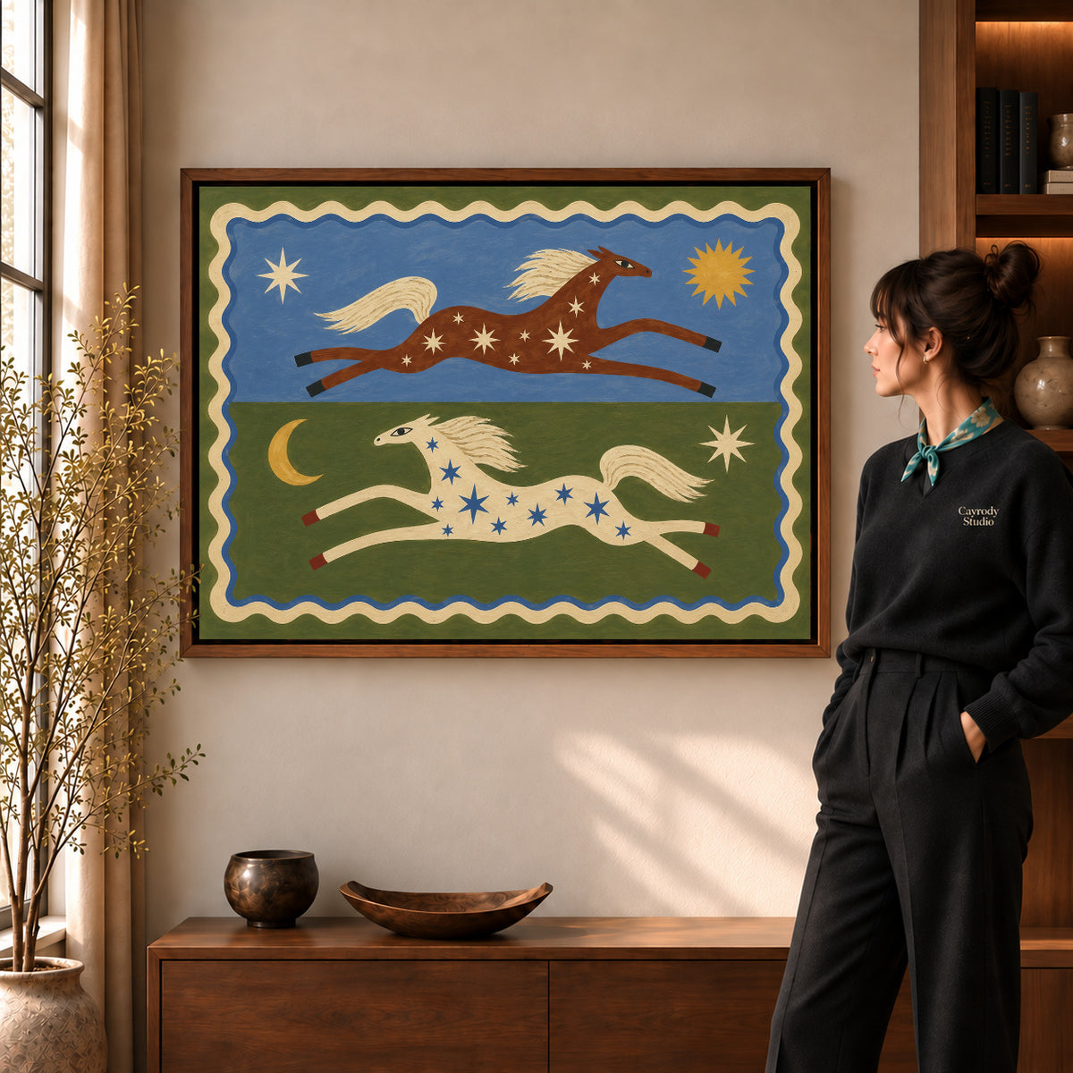 celestial folk horses canvas art shown in the walnut frame option within a warm living room.