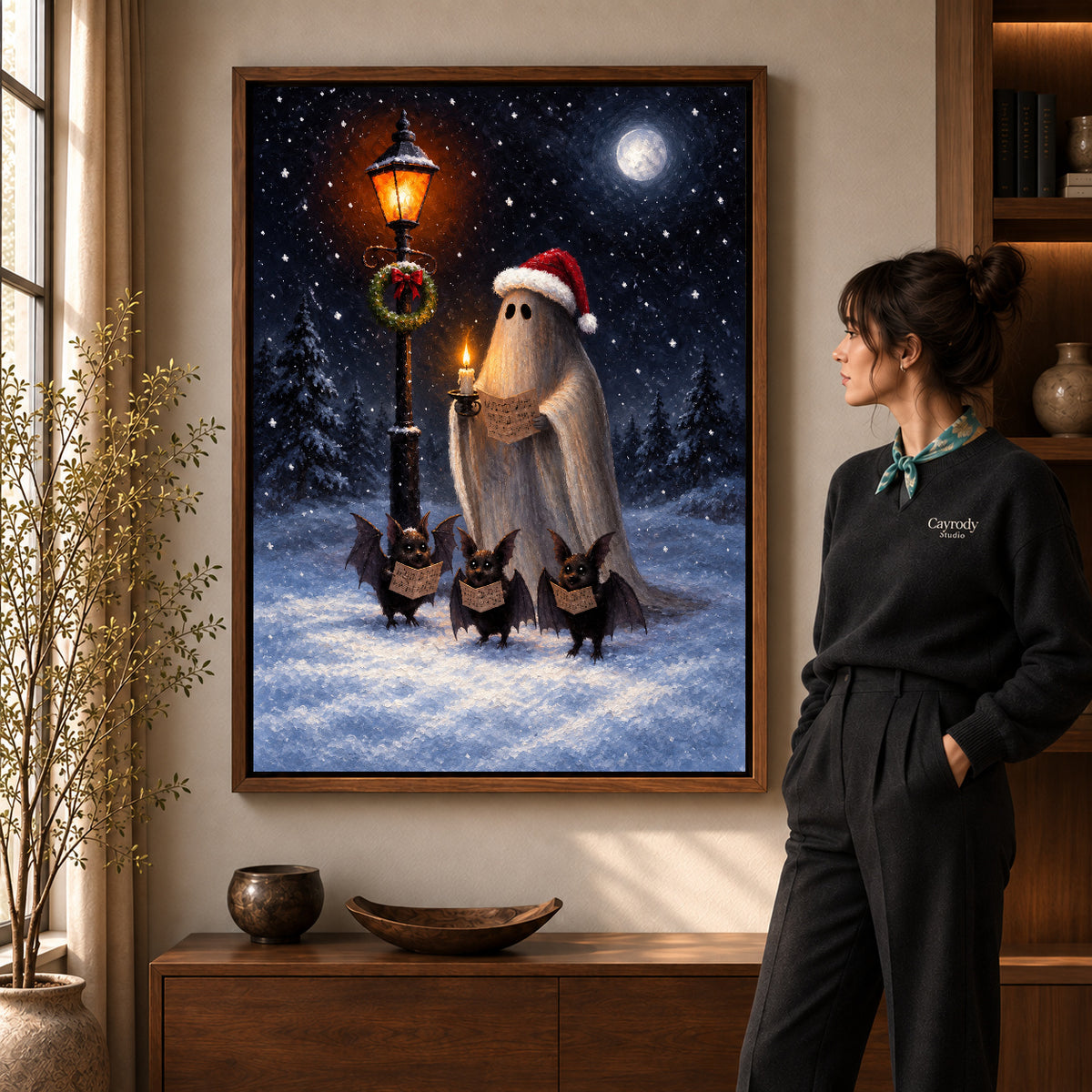 festive ghost choir canvas art in a walnut frame beside a standing woman and wooden console.