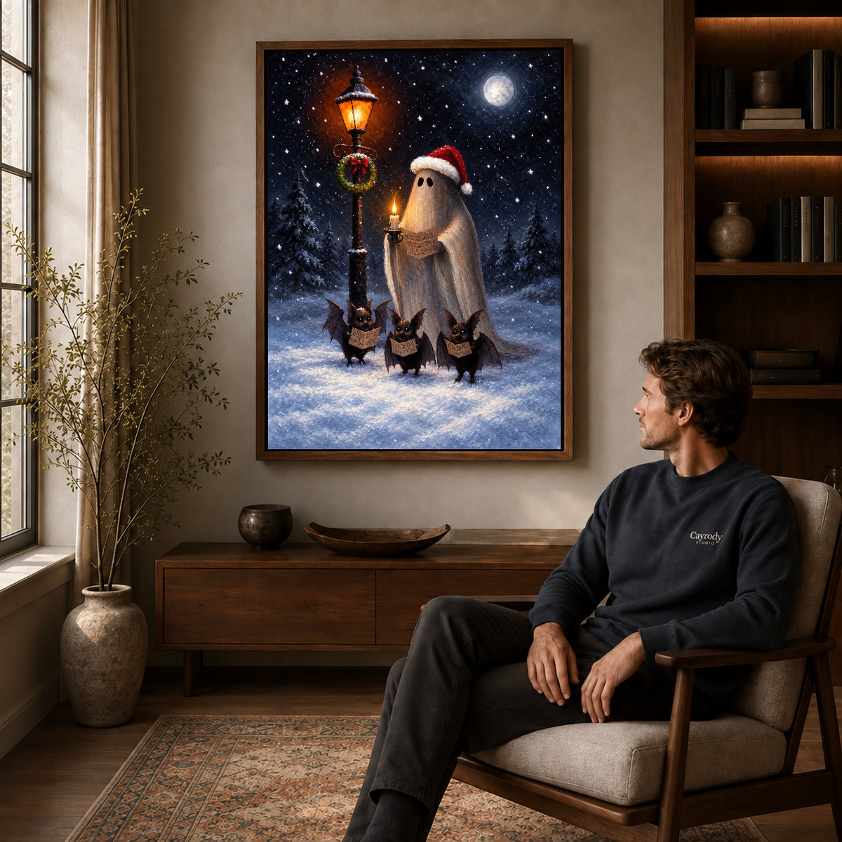 festive ghost choir canvas art in a walnut frame above a console beside a seated man.